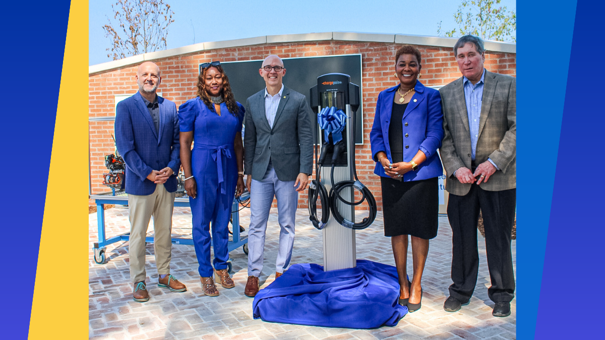 Representatives from Drake State and TVA pose with EV charger.